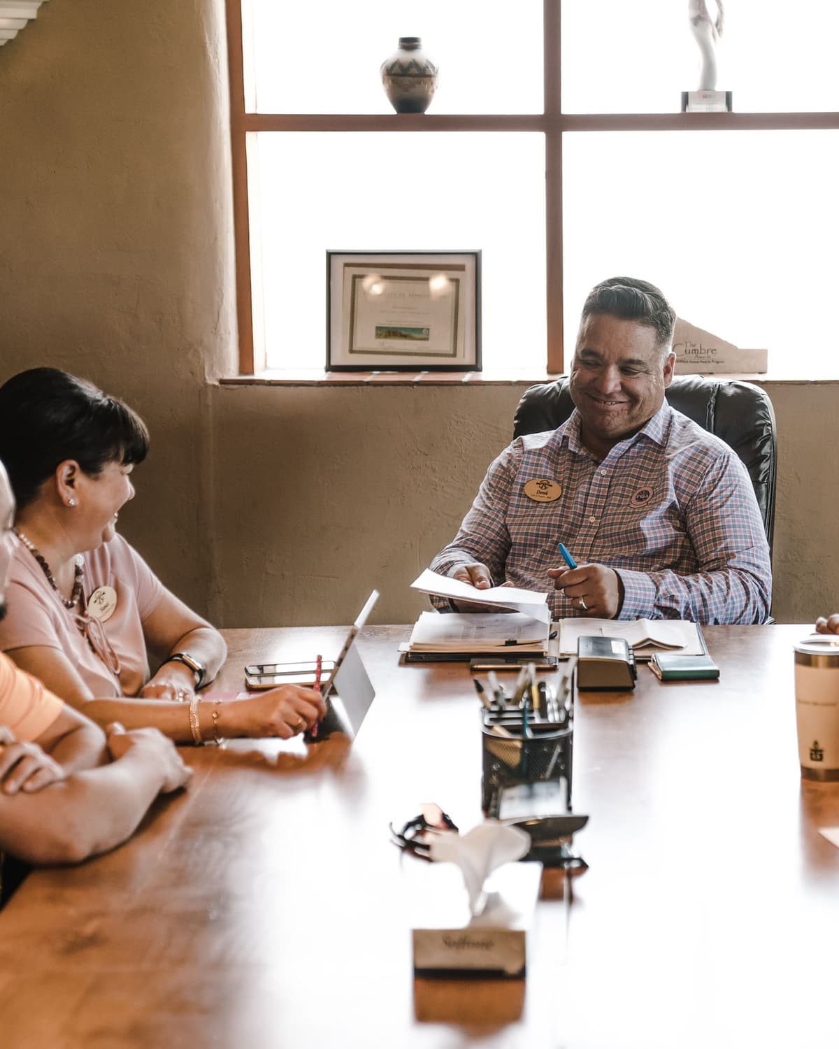 Leadership team seated around a conference table